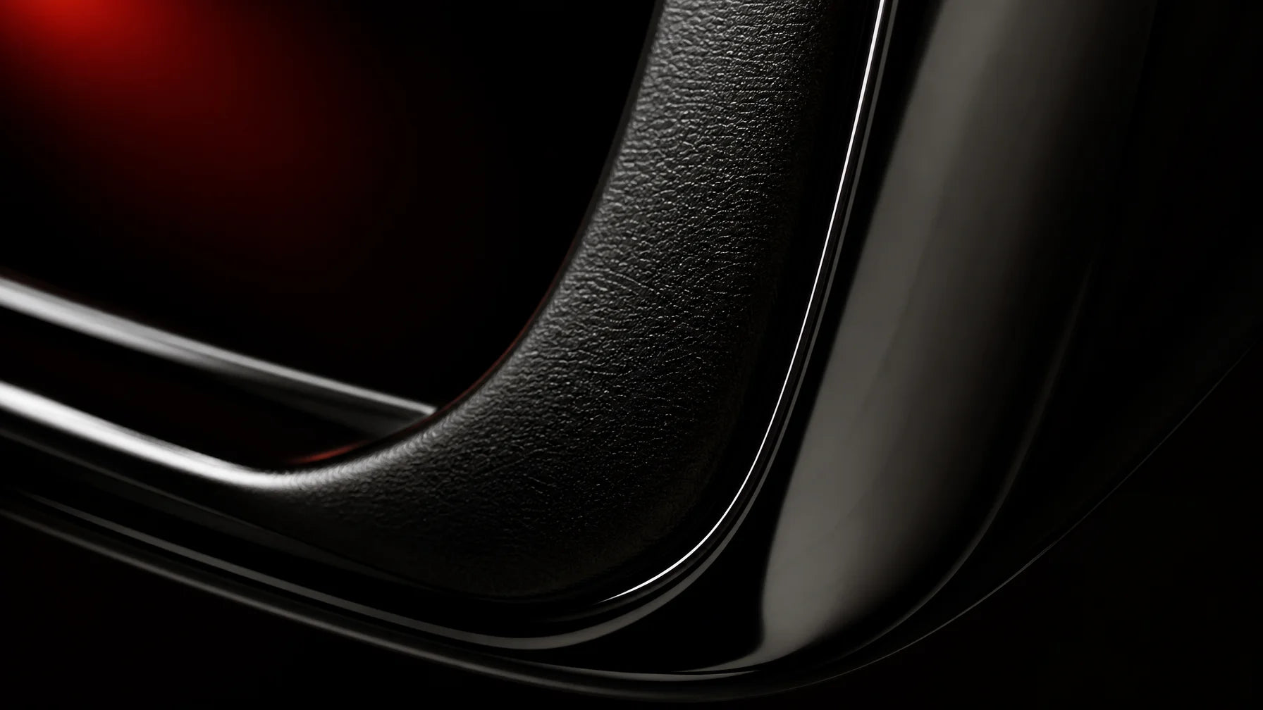 Extreme macro close-up of a car's plastic trim surface after restoration treatment. The surface is d